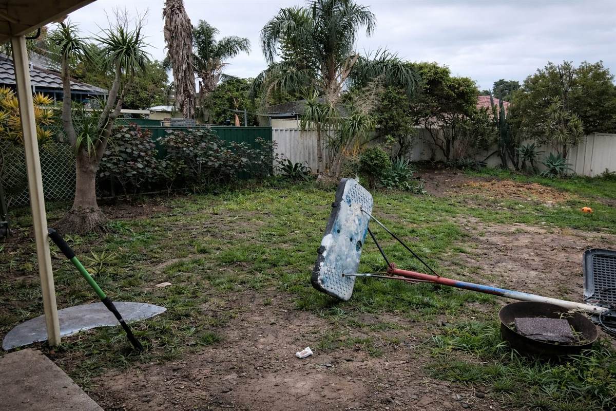 Perth front yard before: dead grass, rubbish, tired retaining wall